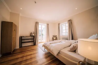 Ein Bett oder Betten in einem Zimmer der Unterkunft Gut Försterlay - Exklusive Boutique Apartments im historischen Winzerhaus direkt an der Mosel