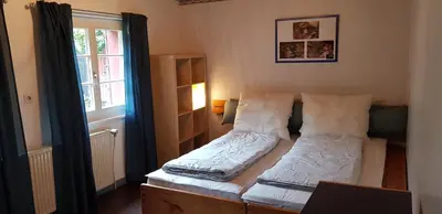 Ein Bett oder Betten in einem Zimmer der Unterkunft Ferienhaus Neumühle