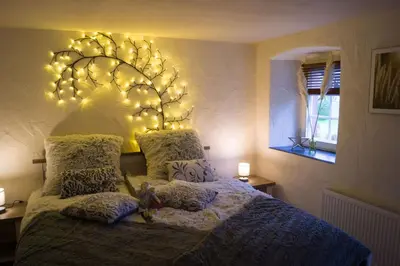 Ein Bett oder Betten in einem Zimmer der Unterkunft Ferienwohnung Zum Jehöschnis