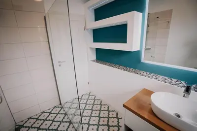 Ein Badezimmer in der Unterkunft SOONWALD Apartment mit Garten & Hot Tube