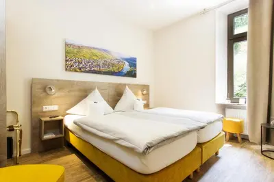 Ein Bett oder Betten in einem Zimmer der Unterkunft Hotel Bären