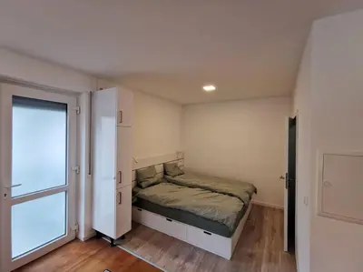 Ein Bett oder Betten in einem Zimmer der Unterkunft Ferienwohnung Zum Moselfischer