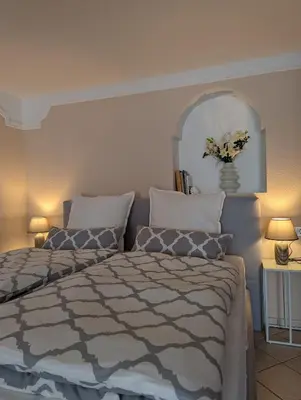 Ein Bett oder Betten in einem Zimmer der Unterkunft Tor zur Teufelsschlucht