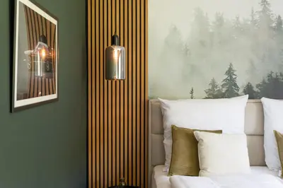Ein Bett oder Betten in einem Zimmer der Unterkunft Hotel Zweite Heimat Nürburg