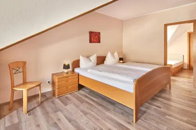 Ein Bett oder Betten in einem Zimmer der Unterkunft Ferienweingut Andrae-Goebel