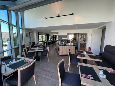 Ein Sitzbereich in der Unterkunft Gästehaus Fuchshof