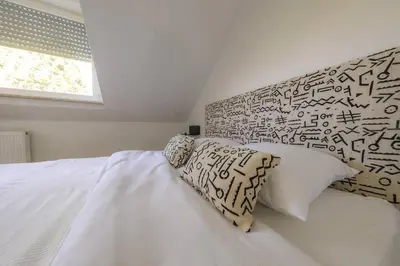 Ein Bett oder Betten in einem Zimmer der Unterkunft Neue Wohnung in der Nähe von Trier