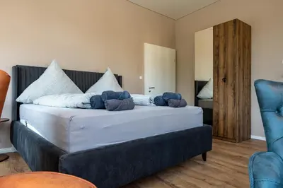 Ein Bett oder Betten in einem Zimmer der Unterkunft Moselresidenz Bellevue Alf Apartment Moselblick