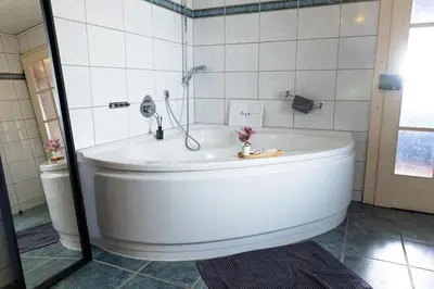 Ein Badezimmer in der Unterkunft Vulkan-Lodge Ferienhaus