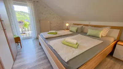 Ein Bett oder Betten in einem Zimmer der Unterkunft Ferienweingut Jürgen Beth