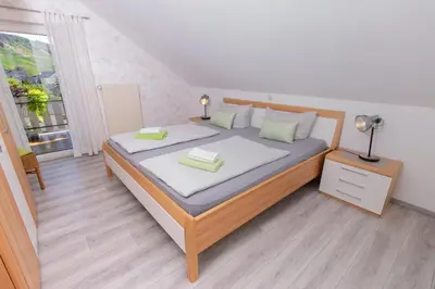 Ein Bett oder Betten in einem Zimmer der Unterkunft Ferienweingut Jürgen Beth