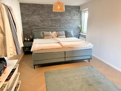 Ein Bett oder Betten in einem Zimmer der Unterkunft JUPAS - Premium Apartments Trier