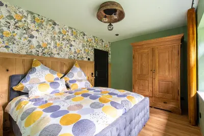 Ein Bett oder Betten in einem Zimmer der Unterkunft Einzigartige Traumwohnung mit Whirlpool & Sauna bietet Luxus und Erholung