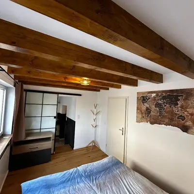 Ein Bett oder Betten in einem Zimmer der Unterkunft Ferienhaus Zur Gasse