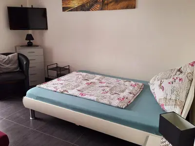 Ein Bett oder Betten in einem Zimmer der Unterkunft Rheinblick