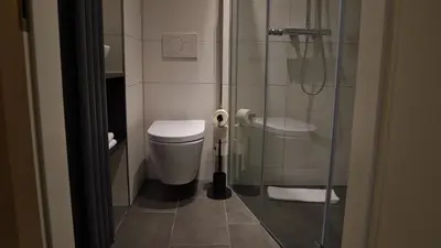 Ein Badezimmer in der Unterkunft Hotel Porta Nigra