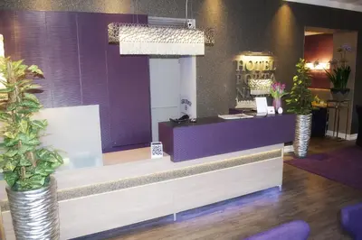 Ein Sitzbereich in der Unterkunft Hotel Porta Nigra