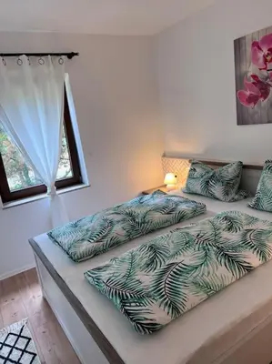 Ein Bett oder Betten in einem Zimmer der Unterkunft Apartment Mahira im Luftkurort Schindeldorf