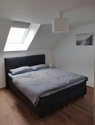 Ein Bett oder Betten in einem Zimmer der Unterkunft Ferienwohnung Natalie