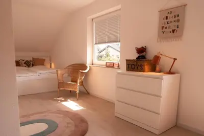 Ein Bett oder Betten in einem Zimmer der Unterkunft Eifel21 - stilvolles Haus in der Vulkaneifel