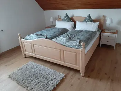 Ein Bett oder Betten in einem Zimmer der Unterkunft Ferienwohnung Marion