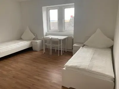Ein Bett oder Betten in einem Zimmer der Unterkunft Schicke Monteurunterkunft in Mendig mit drei Wohneinheiten