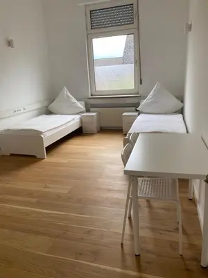 Ein Bett oder Betten in einem Zimmer der Unterkunft Schicke Monteurunterkunft in Mendig mit drei Wohneinheiten