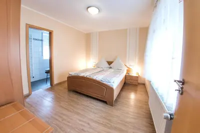 Ein Bett oder Betten in einem Zimmer der Unterkunft Ferienwohnungen Oswald Friederich