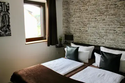 Ein Bett oder Betten in einem Zimmer der Unterkunft Bachmeier's Gasthaus Traube Niederfell