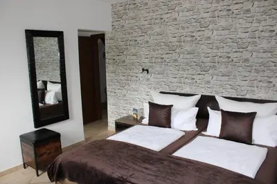 Ein Bett oder Betten in einem Zimmer der Unterkunft Bachmeier's Gasthaus Traube Niederfell