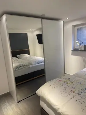 Ein Bett oder Betten in einem Zimmer der Unterkunft Event-Ferienwohnung