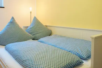 Ein Bett oder Betten in einem Zimmer der Unterkunft Ferienwohnung Auf Sarret