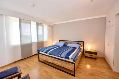 Ein Bett oder Betten in einem Zimmer der Unterkunft PanoramaSicht - Daun von oben