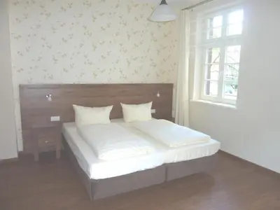 Ein Bett oder Betten in einem Zimmer der Unterkunft Hotel am Markt Sankt Goar