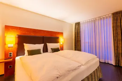 Ein Bett oder Betten in einem Zimmer der Unterkunft DAS WESEL - DEIN HOTEL AM RHEIN