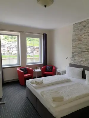 Ein Bett oder Betten in einem Zimmer der Unterkunft Haus Burgfrieden Cochem