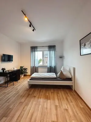 Ein Bett oder Betten in einem Zimmer der Unterkunft Geräumige 3-Schlafzimmer-Wohnung in Koblenz nahe Uni