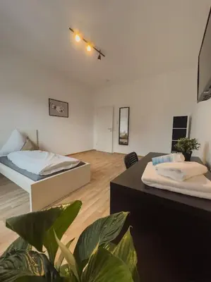 Ein Bett oder Betten in einem Zimmer der Unterkunft Geräumige 3-Schlafzimmer-Wohnung in Koblenz nahe Uni
