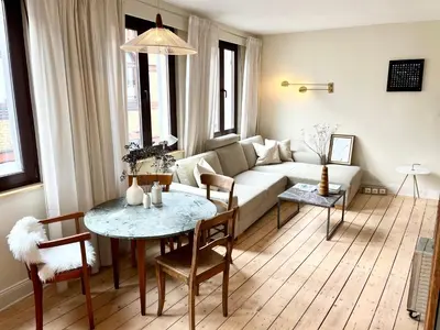 Ein Sitzbereich in der Unterkunft Historisches Apartment Minimalus