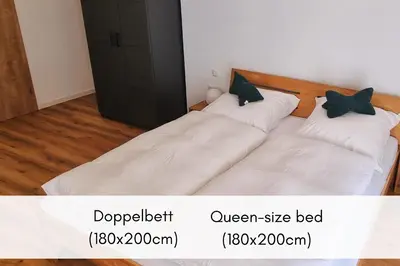 Ein Bett oder Betten in einem Zimmer der Unterkunft Winzerhaus am Calmont - Charme & Moselblick