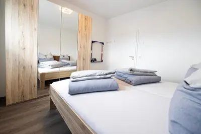 Ein Bett oder Betten in einem Zimmer der Unterkunft Ferienresidenz Hunsrück Hochwald