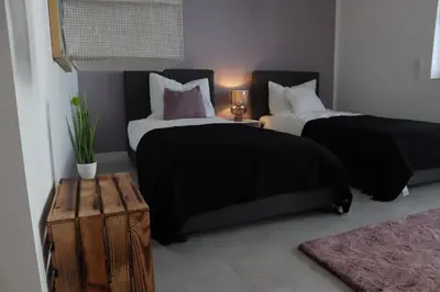 Ein Bett oder Betten in einem Zimmer der Unterkunft RheinMosel Glück 3