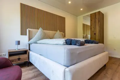 Ein Bett oder Betten in einem Zimmer der Unterkunft Moselresidenz Bellevue Alf