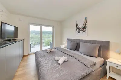 Ein Bett oder Betten in einem Zimmer der Unterkunft Mosel Panorama