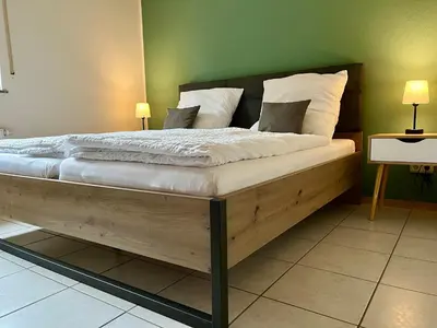 Ein Bett oder Betten in einem Zimmer der Unterkunft Ferienapartments Eifel Stay