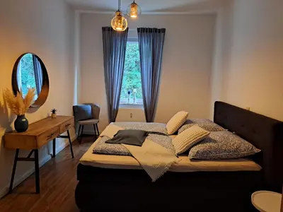 Ein Bett oder Betten in einem Zimmer der Unterkunft Blick zum Brückentor
