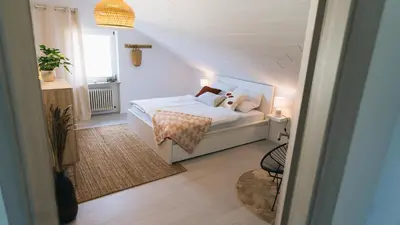 Ein Bett oder Betten in einem Zimmer der Unterkunft Eifel17 - Die Ferienwohnung