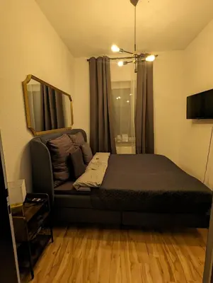 Ein Bett oder Betten in einem Zimmer der Unterkunft Schönes 3 Zimmer Apartment in der Altstadt von Koblenz