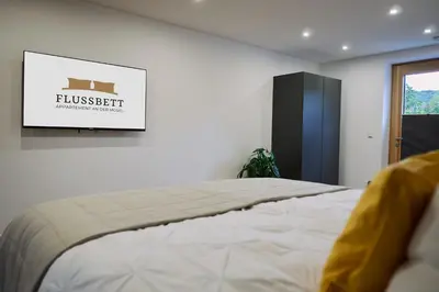 Ein Bett oder Betten in einem Zimmer der Unterkunft Flussbett - Appartement an der Mosel