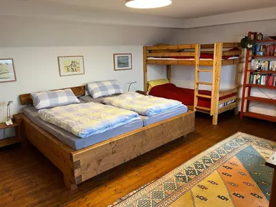 Ein Bett oder Betten in einem Zimmer der Unterkunft Eifel Landhaus Panoramablick unter der Burg Olbrück mit Sauna Hottub großer Terrasse und Garten Ideal für Familien